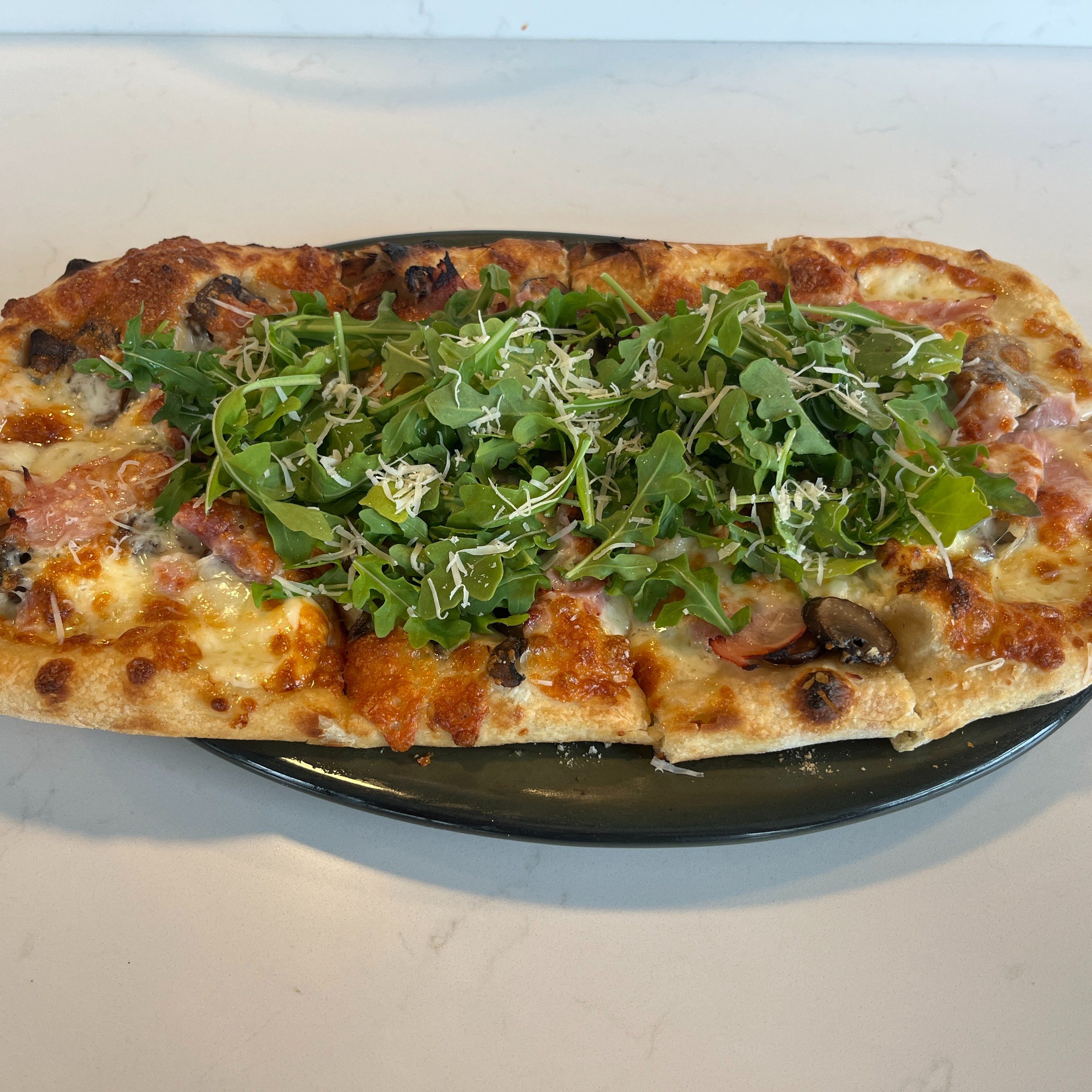 Mushroom & Prosciutto Cotto Bianca Pizza.